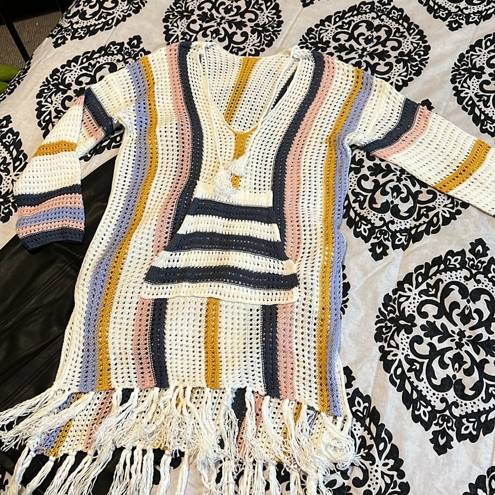 Love of crochet multi color dress or top.